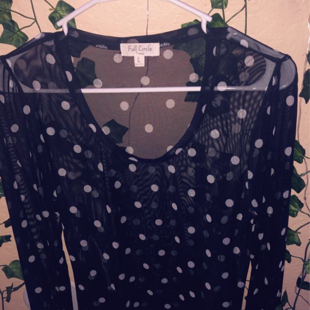 A polkadot long sleeve top
